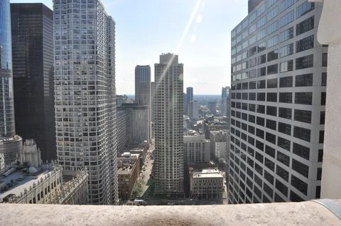 Looking over a ledge at the Chicago skyline in summer day Stock Photos