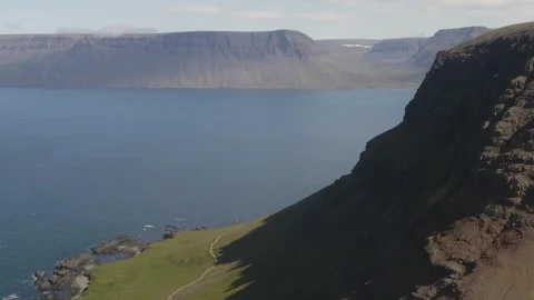 Looking over mountains coming straight up from the sea in the Westen Stock Footage 255014616