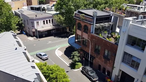 Looking over suburb intersection with bike path Stock Footage 82753711