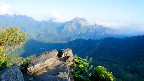 Looking over a valley from a high point of view on a mountain at midday. Stock Photos