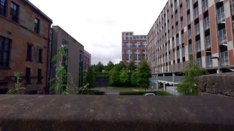 Looking over a wall at modern buildings Video stock 200262047