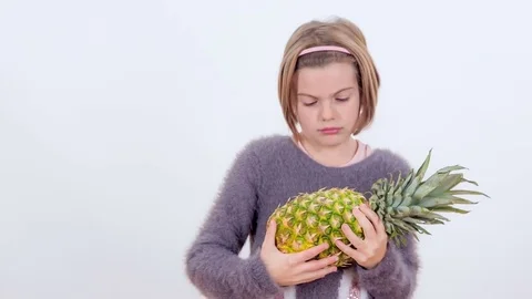 Looking at a pineapple Stock Footage 83724386