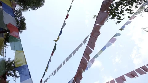 Looking up at prayer flags in Nepal in slow motion Stock Footage 91135970
