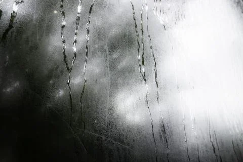 Looking at the rain through the window Stock Photos