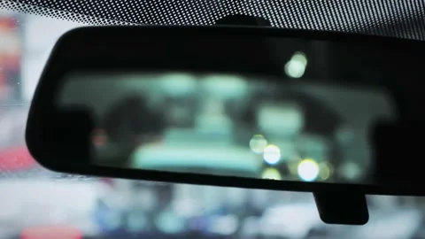 Looking at the rearview mirror of a car while driving Stock Footage 205919194
