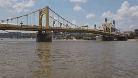 Looking at Roberto Clemente Bridge with a Pickle festival taking place on Stock Footage 113847287