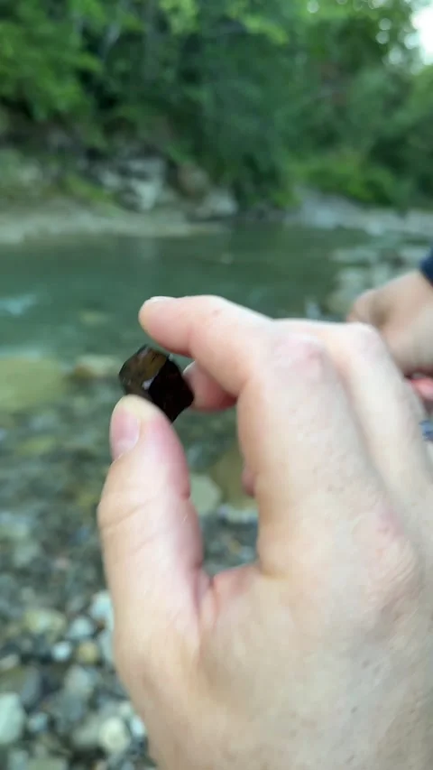 Looking for rocks at mountain river Stock Footage 261514053