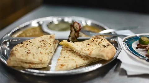 Looking at Roti on table Video stock 65804725