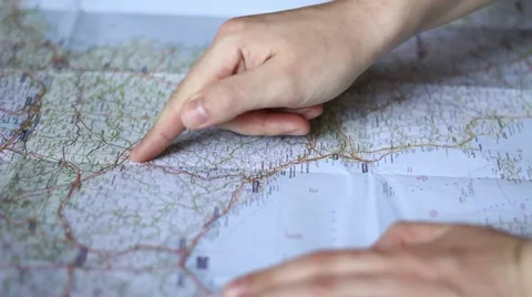 Looking at a route on a map Vídeo Stock 10817040