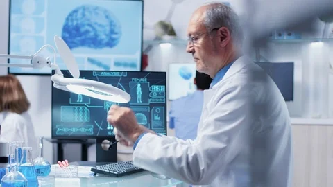 Looking at a sample through a magnifying glass Stock Footage 111006505