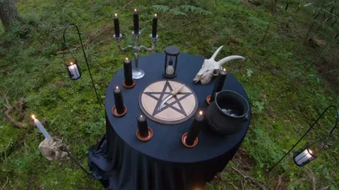 Looking at scary Satanic Ritual Table in the woods 4k60fps Stock Footage 135833507