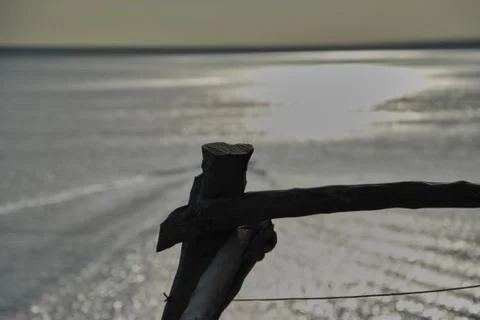 Looking at the sea from the railing Stock Photos