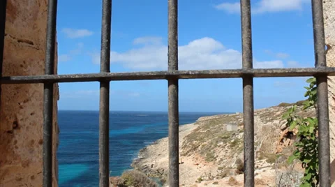 Looking at sea through bars Stock Footage 33630273