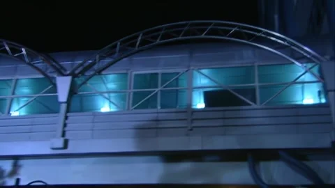 Looking up at the second floor corridor and tall buildings at night Stock Footage 253771481