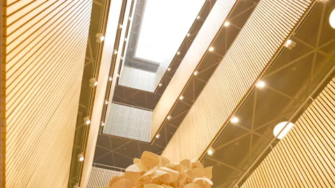 Looking several building floors up underneath throwing throw moving boxes Video stock 166248299