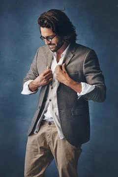 Looking sharp as always. Studio shot of a handsome young man posing against a Stock Photos