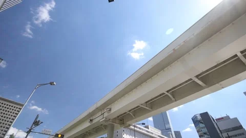 Looking up the sky and pan down to cityscape of Tokyo Japan. Stock Footage 220097094