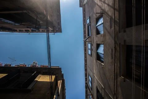 Looking at the sky between buildings Stock Photos