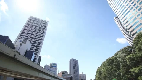 Looking up the sky of city. Pan down to the river. Stock Footage 220096625