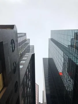 Looking Up At The Sky Through Rows Of Montreal Buildings Stock Photos