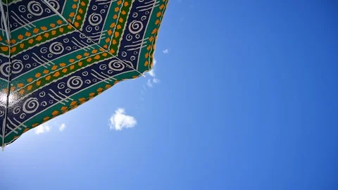 Looking at the sky from under the beach sun  umbrella Stock Footage 111038315