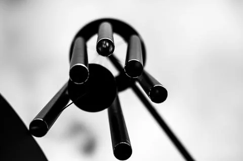 Looking up to the sky underneath a spinning wind chime. Stock Photos