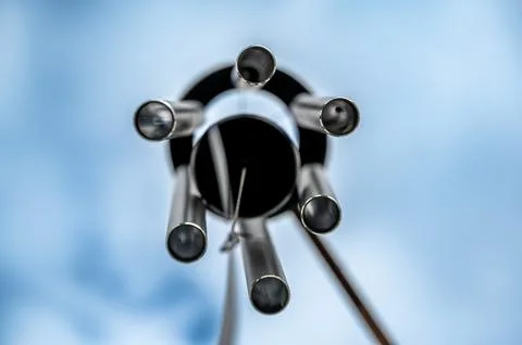 Looking up to the sky underneath a spinning wind chime. Foto stock