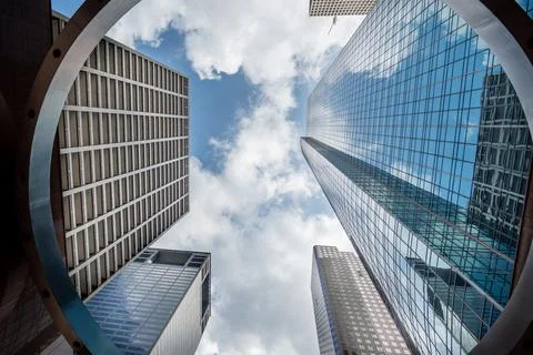 Looking up skyscraper through circle architecture in downtown Houston, Texas 스톡 사진