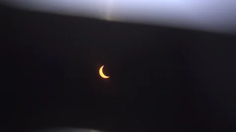 Looking at solar eclipse through sunglasses 4k Stock Footage 92283157