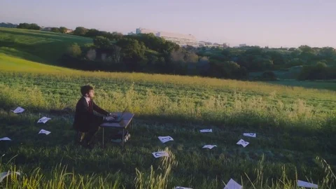 Looking for solution. Young businessman with computer in the middle of the Stock Footage 76681368