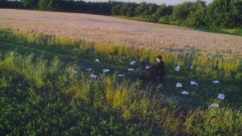 Looking for solution. Young businessman with computer in the middle of the Stock Footage 76682857
