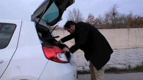 Looking for something in trunk Stock Footage 237791003