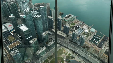 Looking southeast from CN Tower, condos, harbour front,  Lake Ontario Stock Footage 192039282