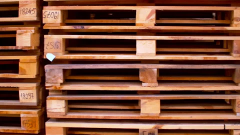 Looking on the stack of wooden palettes storage the logistics warehouse. Video stock 150518325