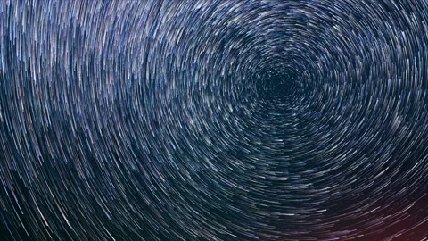 Looking straight up into a dark night sky that has colorful stars in comet-mode. Stock Footage 262460526