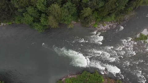 Looking straight down at Skykomish River in Cascade Mountains Washington Stock Footage 146243782