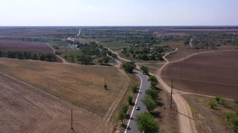 Looking on the summer village with a fields around Stock Footage 152506792