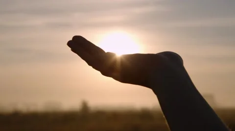Looking at the sun through the hand Stock Footage 44448522