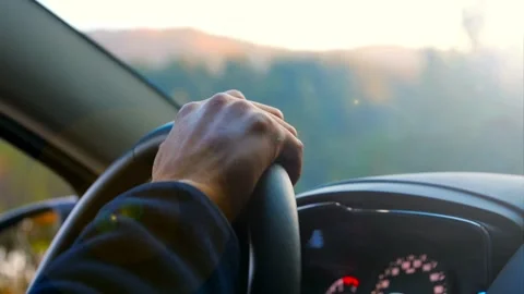 Looking the Sunset in a Car. view from inside a car with light from sun at Stock-Footage 336267419