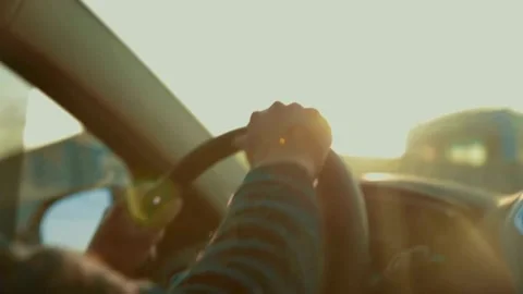 Looking the Sunset in a Car. view from inside a car with light from sun at Stock-Footage 336267590