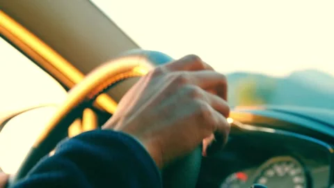 Looking the Sunset in a Car. view from inside a car with light from sun at Stock-Footage 336267775