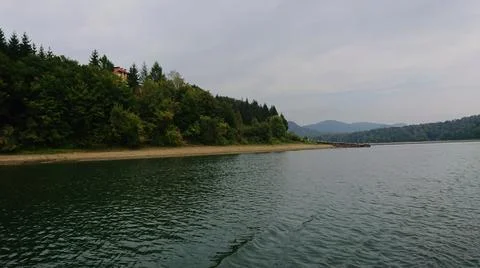 Looking at the surface of a large and beautiful mountain lake Stock Photos