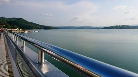 Looking at the surface of a large and beautiful mountain lake Stock Photos