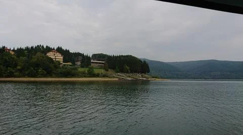 Looking at the surface of a large and beautiful mountain lake Stock Photos