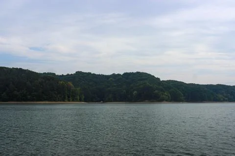 Looking at the surface of a large and beautiful mountain lake Stock Photos