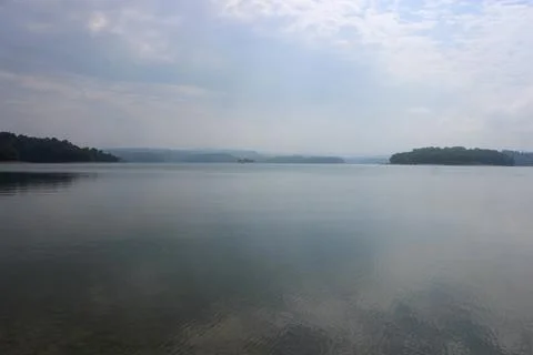 Looking at the surface of a large and beautiful mountain lake Stock Photos