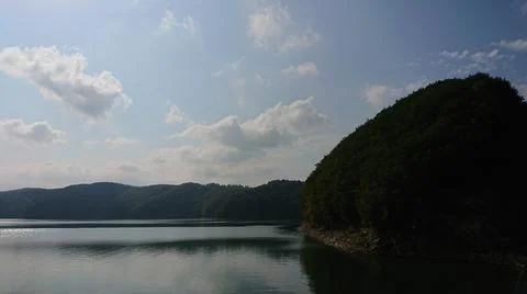 Looking at the surface of a large and beautiful mountain lake Stock Photos