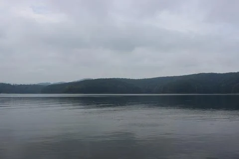 Looking at the surface of a large and beautiful mountain lake Stock Photos