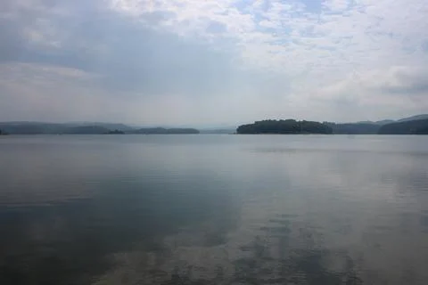 Looking at the surface of a large and beautiful mountain lake Stock Photos