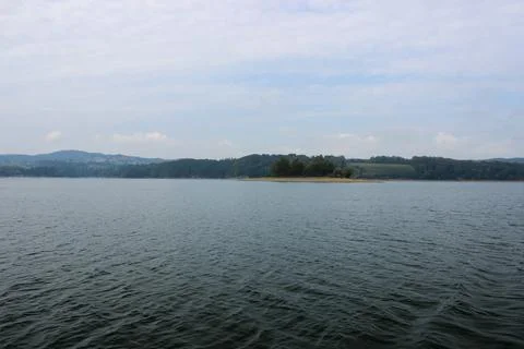 Looking at the surface of a large and beautiful mountain lake Stock Photos